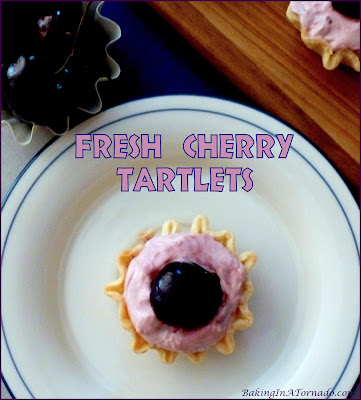 Fresh Cherry Tartlets, fresh juicy cherries and a fluffy cream cheese filling in a quick baked pie crust. | Recipe developed by www.BakingInATornado.com | #recipe #cherry #pie