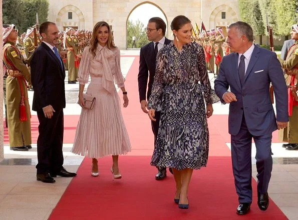 Crown Princess Victoria wore Samsøe&Samsøe Joanna ss shirt and Cathy skirt and By Malene Birger pumps. Queen Rania