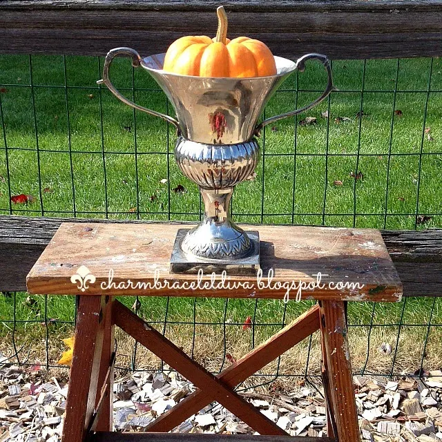 estate sale silver loving cup with baby boo pumpkin