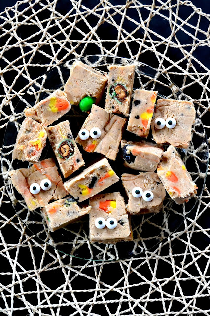 Fudge made with white chocolate and marshmallow creme packed with oreos, M&M's and candy corn