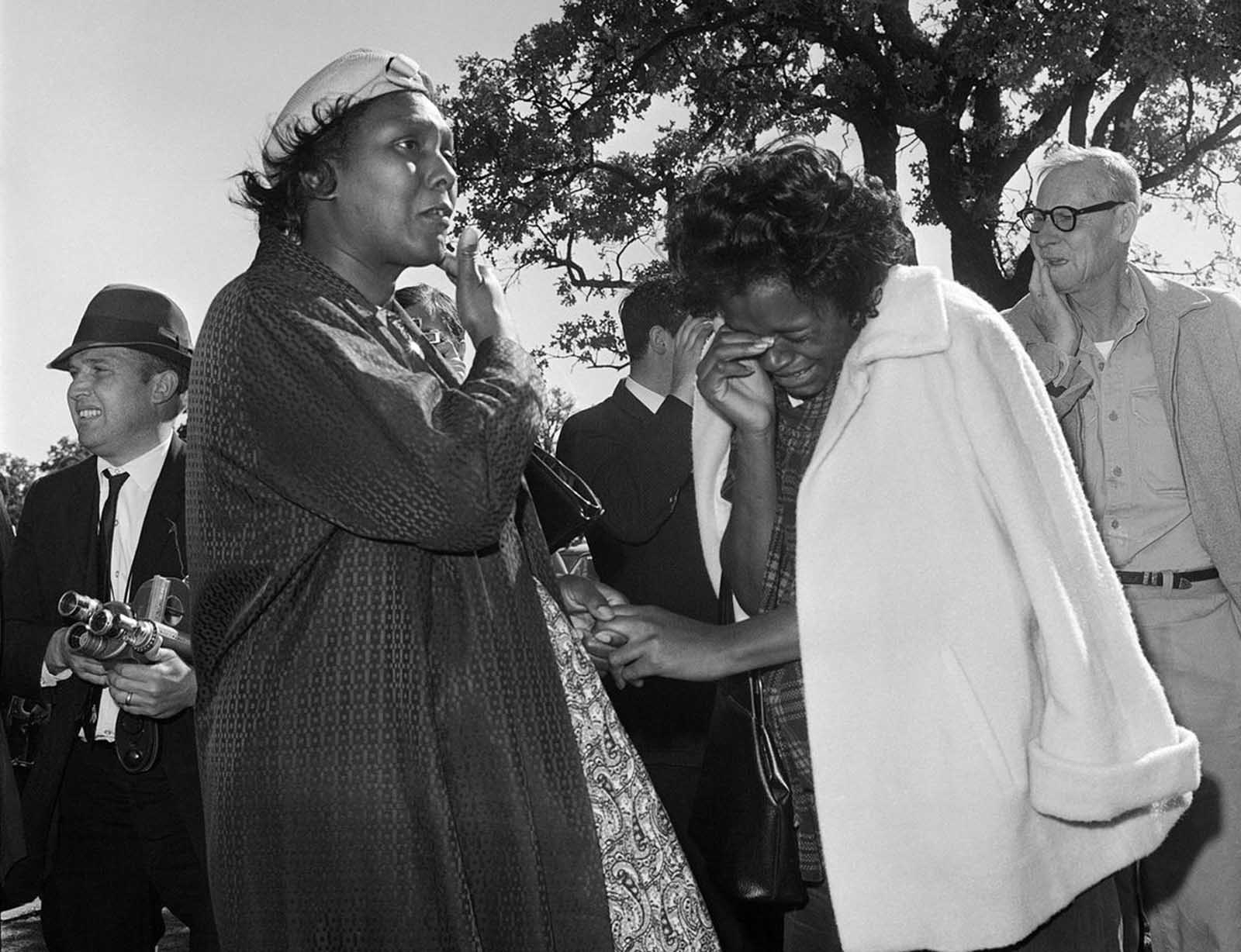 Women burst into tears outside Parkland Hospital upon hearing that President John F. Kennedy died from a gunshot wound while riding in a motorcade in Dallas, on November 22, 1963.