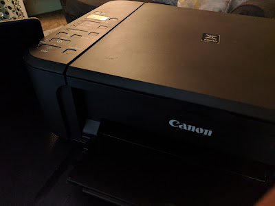 Impresora Canon MP230 negra con error de almohadillas llenas.