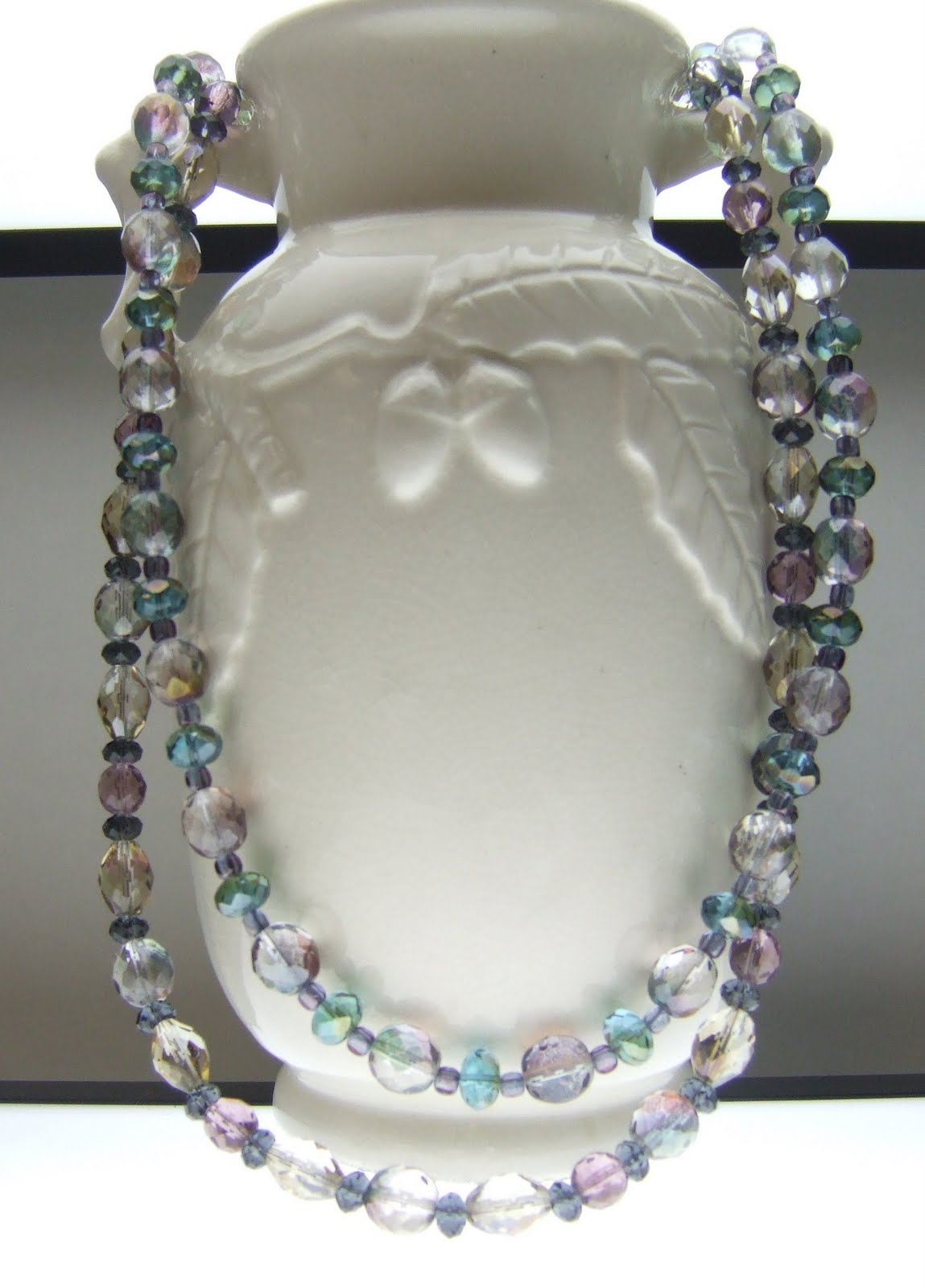 Treena Rowan's Art Blog jewelry with crystals, shown on antique vase