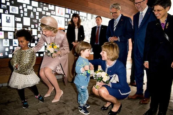 Queen Mathilde of Belgium and Daniela Schadt, partner of German President meet students of the Antwerp Fashion Academy during a visit to the MoMu fashion museum