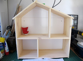 Completed IKEA FLISAT dolls' house with a 1/12 scale egg chair in one room for scale.
