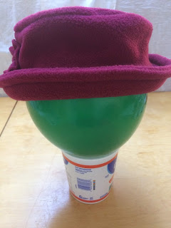 Maroon fleece hat with upturned brim.