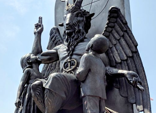 The Satanic Temple unveils its statue of Baphomet, a winged-goat creature, at a rally for the first amendment in Little Rock, Ark., Thursday, Aug. 16, 2018. (AP/Hannah Grabenstein)