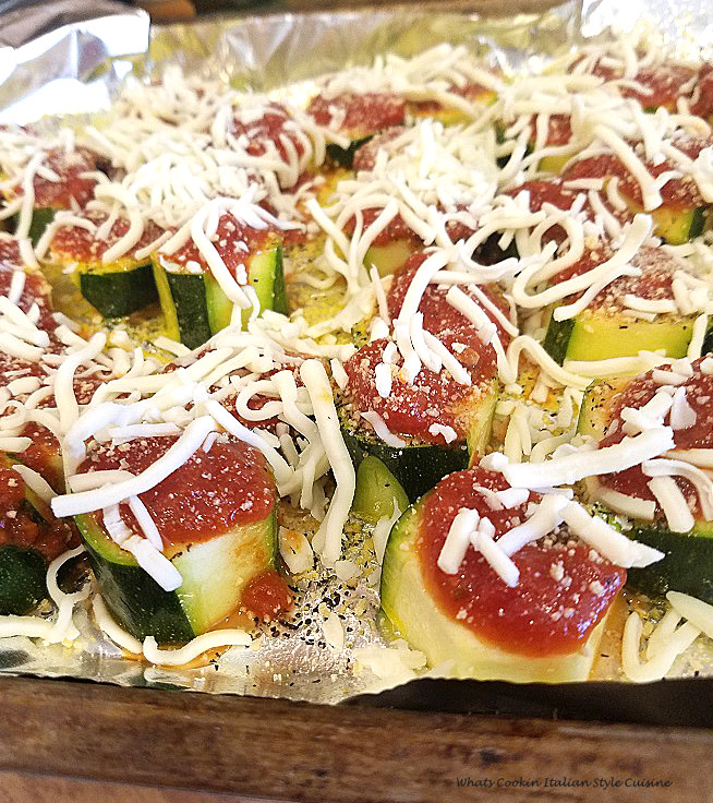 Sliced thick zucchini made into mini pizza with sauce and mozzarella on topped then baked