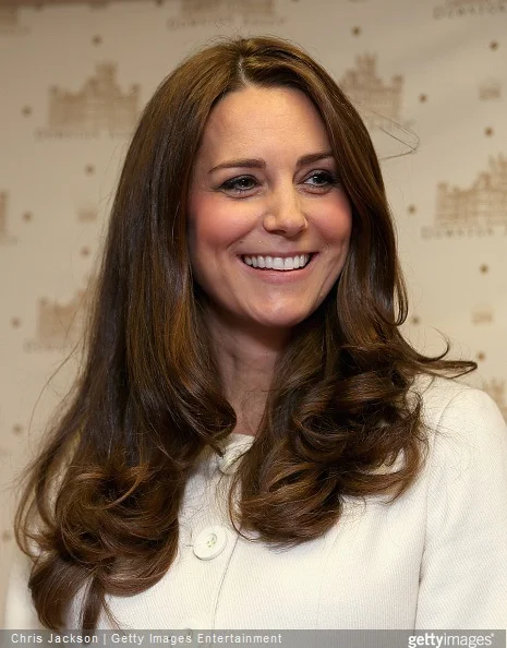 Catherine, Duchess of Cambridge smiles during an official visit to the set of Downton Abbey at Ealing Studios
