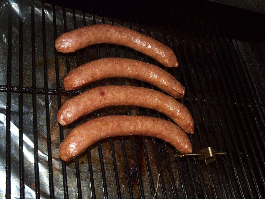 Pellet Smoker Cooking Polish Sausage and Homemade Sauerkraut