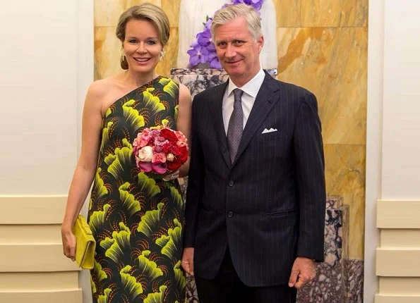 Queen Mathilde of Belgium wore a printed dress from Dries Van Noten SS 2018 collection, and she wore Natan pumps and carried Natan clutch
