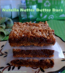Nutella Nutter Butter Bars are for all of the chocolate and peanut butter lovers in our lives. | Recipe developed by www.BakingInATornado.com | #recipe #dessert