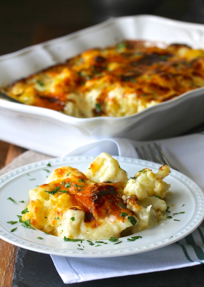 Cauliflower Cheese is a delicious dish of cauliflower baked in the cheesiest cheddar sauce until it is bubbly and golden.