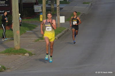 Leading #561 Chris Haynes (2nd, 15:21), #803 Justin Garrard (1st, 15:15) motors down Michelob Ridge to the Budweiser Creek bridge and victory at the finish line of the 2018 Palace Saloon 5K Justin Garrard, Chris Haynes