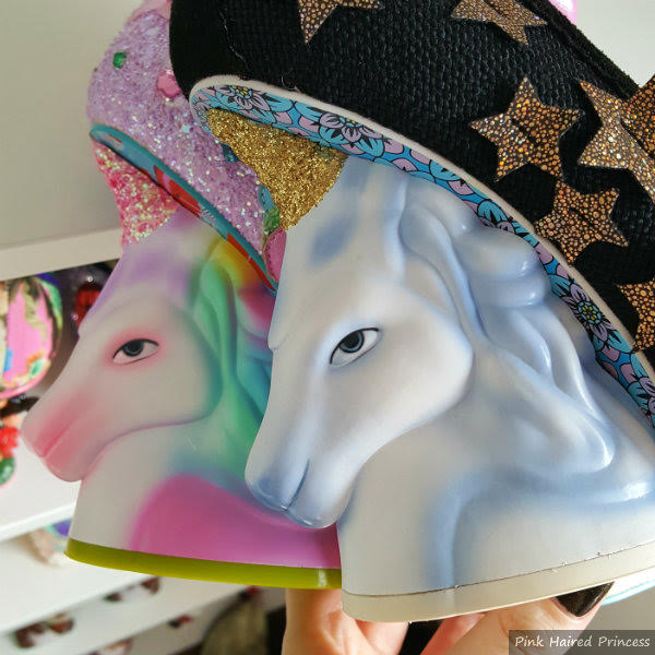 Irregular Choice unicorn head heels comparison with old model new and old unicorn heels being held in hand