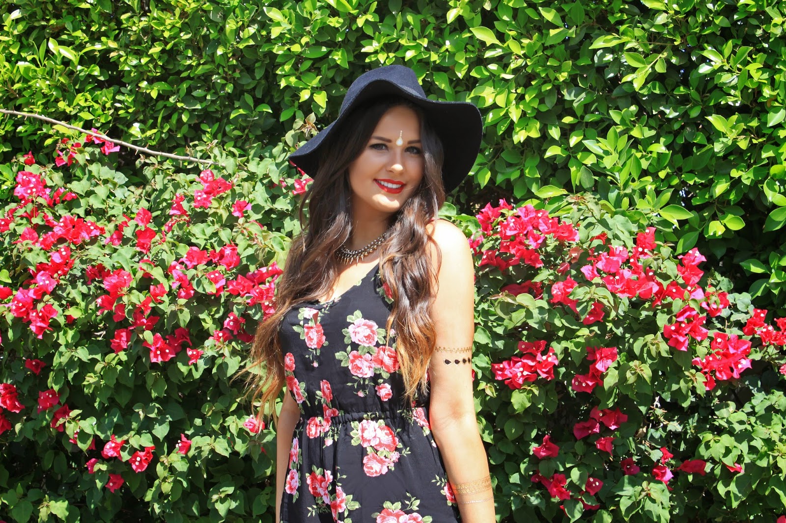Fashion blogger Mash Elle models a Forever 21 floral romper for Coachella - What to Wear to Coachella by popular Orlando fashion blogger, Mash Elle