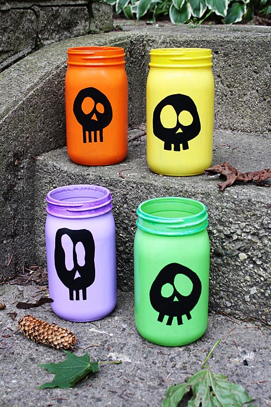 Halloween colorful skull luminaries Colorful skull luminaries for Halloween. 25 best Halloween Mason jar craft ideas. Mason jar painted ghost ideas. Scary ghost paint on Mason jar. Halloween ghost decoration on Mason jar ideas. Best Halloween jar decoration for outdoor. Halloween party decoration ideas.