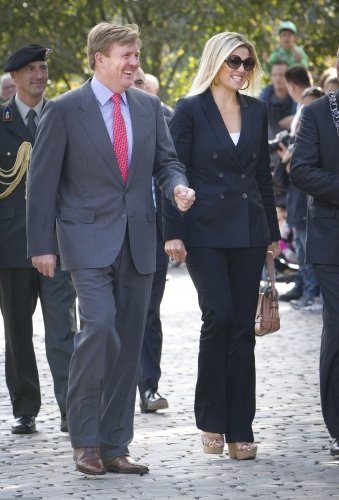 Crown Prince Willem-Alexander and Crown Princess Maxima opens the new visitor center. Armani suit