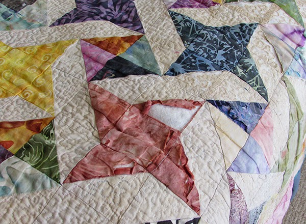damaged scrapy bed quilt