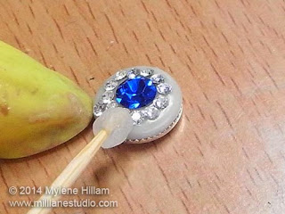 Use epoxy resin clay to create a pair of beautiful, elegant earrings reminiscent of Princess Kate's engagement ring. Click the link in the text to go to the full tutorial.