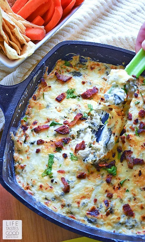 Cheesy Kale and Bacon Dip | by Life Tastes Good is a tasty mix of cheeses, kale, bacon, and a splash of wine for that little extra somethin' somthin' <wink>. This appetizer dip is delicious served hot or cold and goes great with vegetables, chips, crackers, you name it! It is a real winner with the added bonus of having good-for-you kale mixed in.