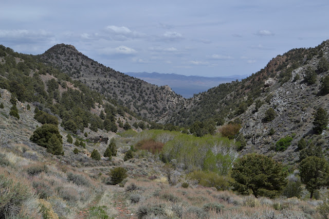 back out the canyon, only a little bit of stone building is visible