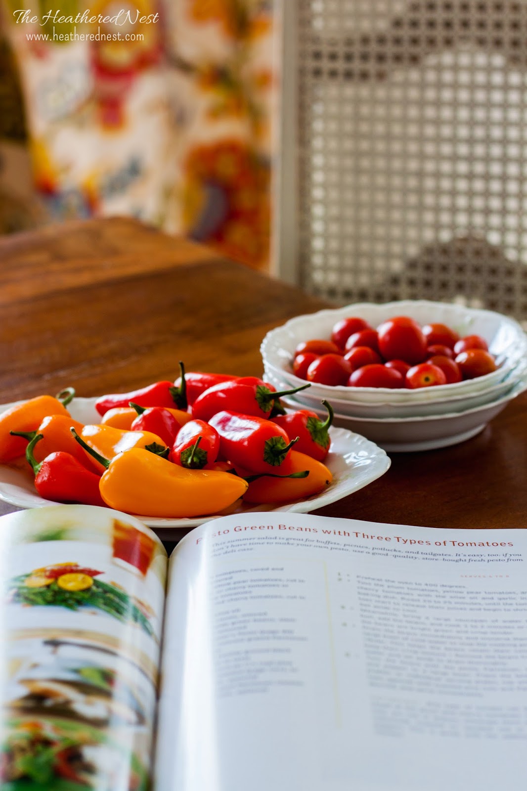 close up of cookbook and spring peppers and tomatoes