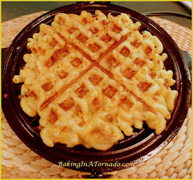 Mac and Cheese Waffles and Honey Bunches Chicken: cruchy cheesy Macaroni and Cheese waffles with a hint of bacon, topped with Honey Bunches  crusted Chicken and drizzled with Maple Syrup | Recipe developed by BakingInATornado.com | #recipe #waffles #chicken