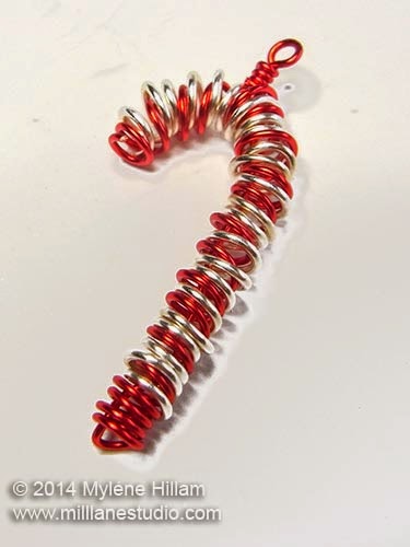 Red and silver wire candy cane with wrapped loop at the top for hanging.