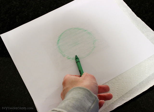 Trace lid with a crayon to cut paper to the right size.