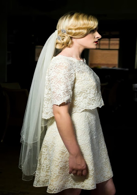 Side view of William Cahill white mini in lace, with integral cape. c HVB vintage wedding blog 2013