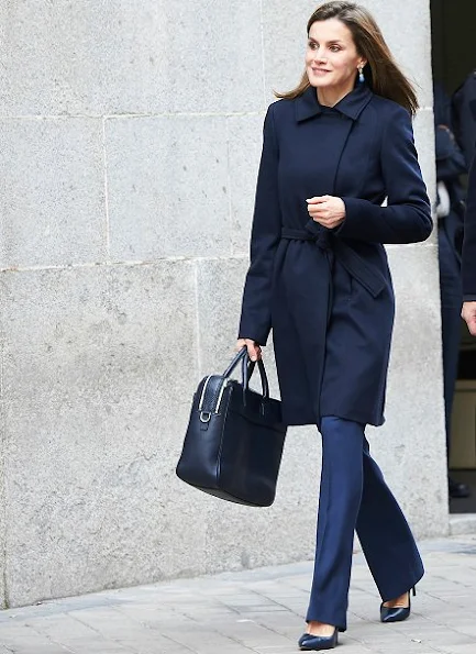 Queen Letizia wore Hugo Boss trousers, Magrit Pumps, Hugo Boss Jacket, Carolina Herrera wool coat, Tous earrings