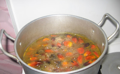 Boiling banga palm nuts