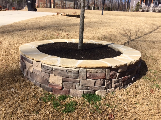 Two Brothers Landscaping, LLC: Cinder block and stone veneer it's quite