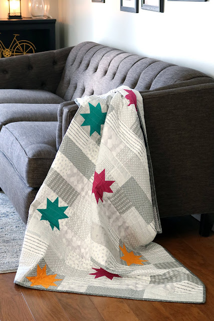 Stellar quilt pattern found in the Fresh Fat Quarter Quilts book by Andy Knowlton of A Bright Corner - a modern throw quilt with a low volume background