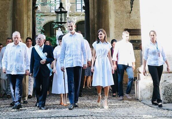 Queen Letizia wore Adolfo Dominguez embroidered cotton dress with belt. Letizia wore a new aquamarine blue midi dress