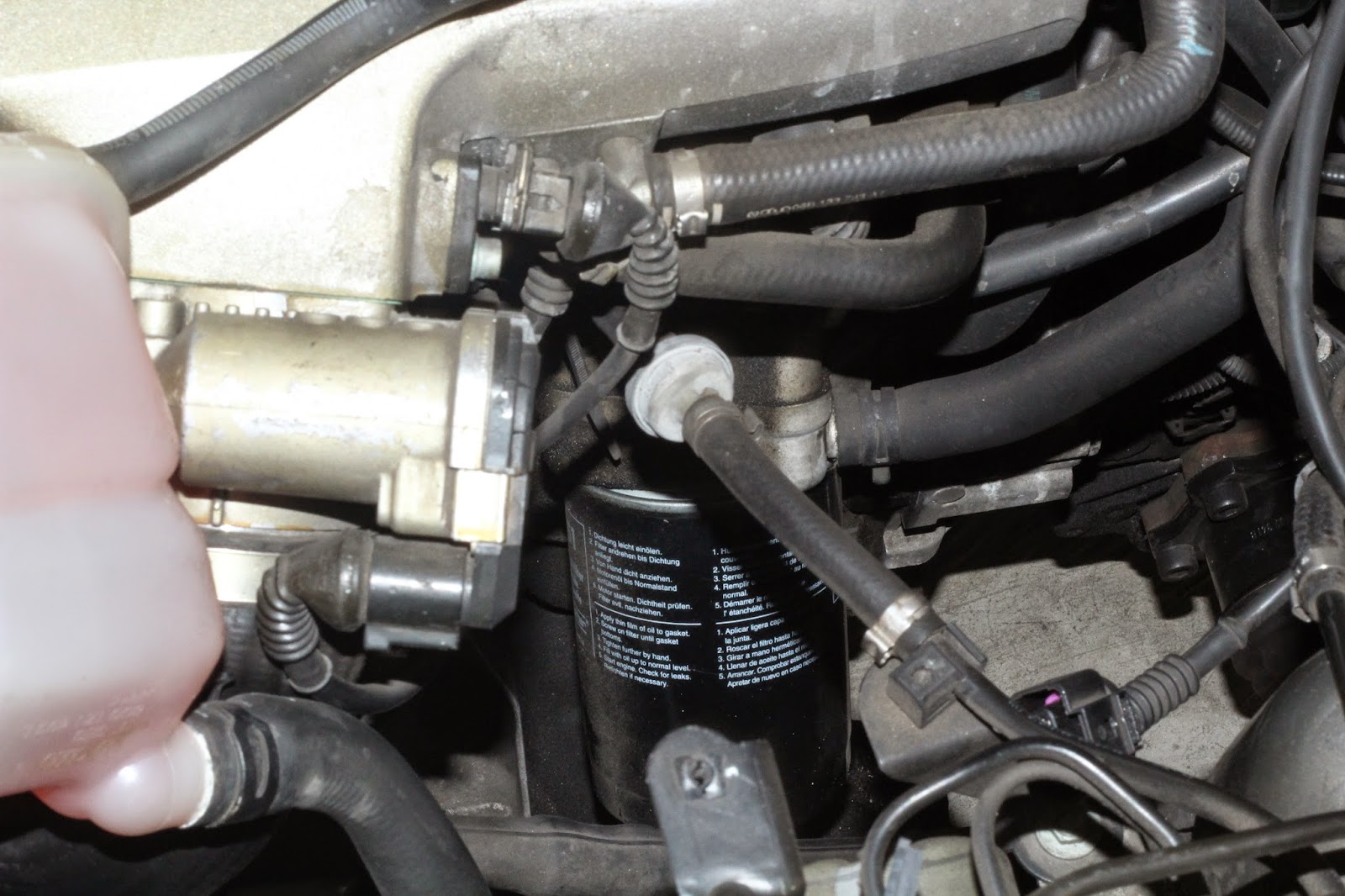 3. Remove filter by loosening it with filter wrench, and by turning with  your hand counter clock wise. While you do this step leave some news papers  on the ...