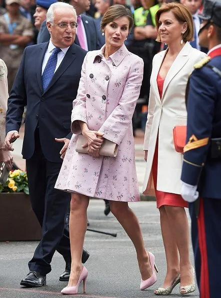 Queen Letizia wore Carolina Herrera Coat and Queen Letizia Jewels Coolook Sarin Earrings, she wore Magrit pups and carried clutch at Armed Forces Day