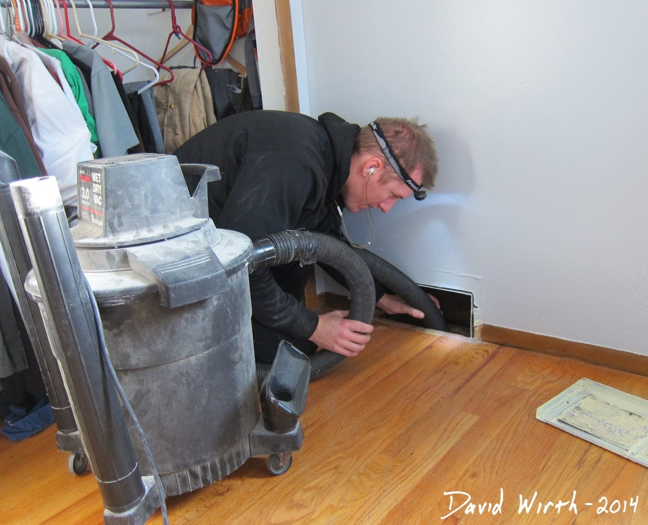 vacuuming out heat vents, air vents, shop vac, clean