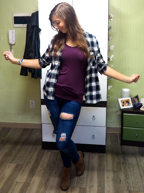 Checked Out - casual outfit of blue and white checked shirt, purple t-shirt, ripped blue skinny jeans, and brown ankle boots