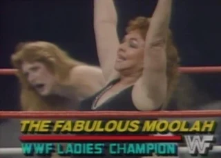 WWF / WWE WRESTLEMANIA 2 - The Fabulous Moolah celebrates her win over Velvet McIntyre