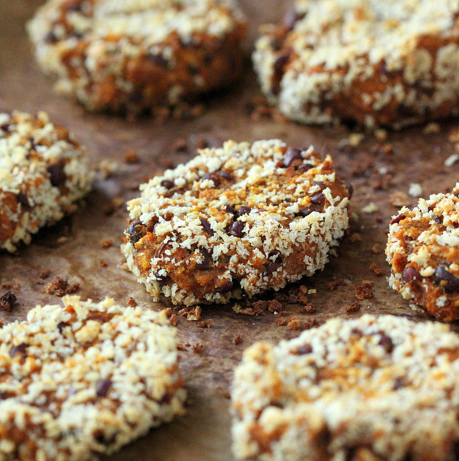 Plant-based burger patties on a baking sheet lined with parchment paper