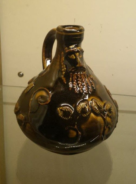 Ceramic Bartmann (Bellarmine) jug in Amber Celadon by Lily L.