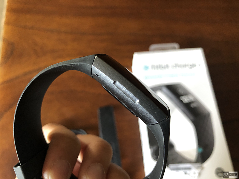 where is the tracker button on fitbit charge 3
