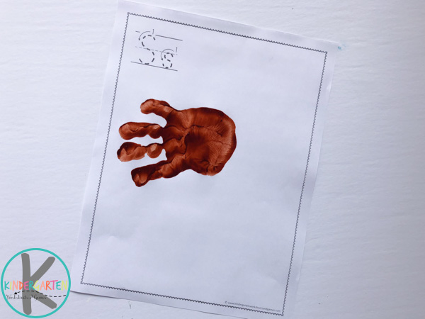press-brown-handprint-repeat-to-make-spider