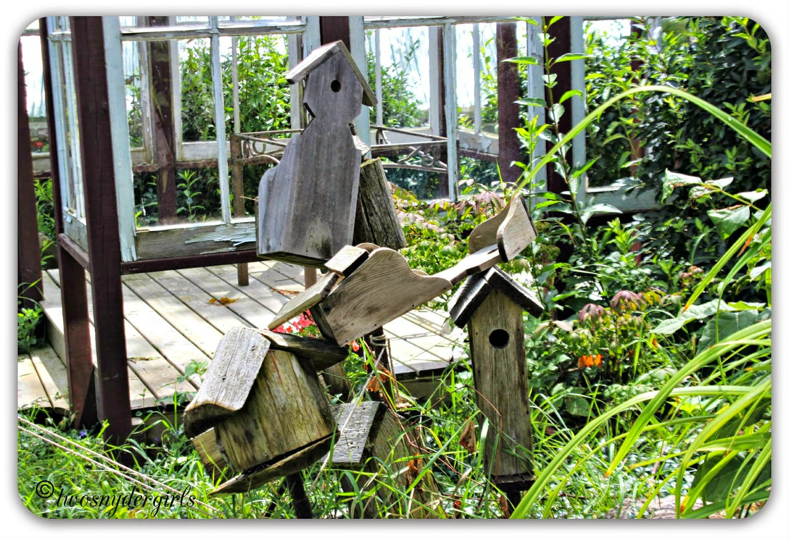A creative place to write wooden birdhouses in a jumble
