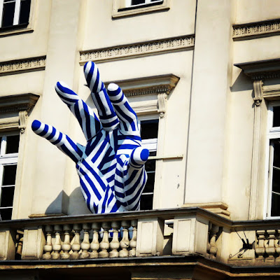 Giant striped blue hand sculpture in Warsaw, Poland