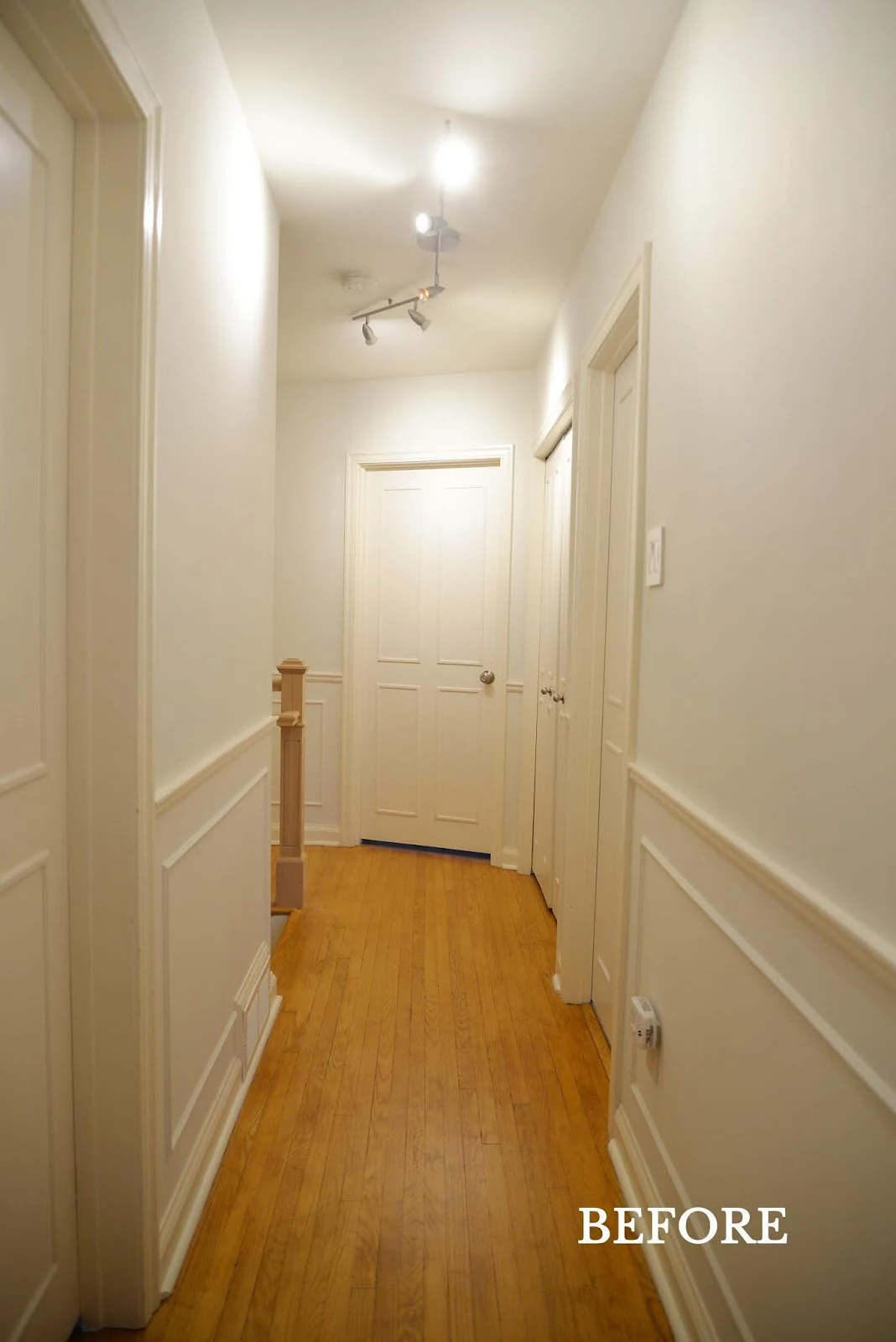 hallway with cream trim and moulding