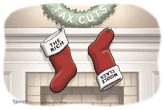Christmas stockings hanging on mantel beneath a wreath labeled 