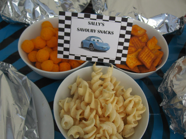 Snacks with a sign that reads Sally's Savoury Snacks